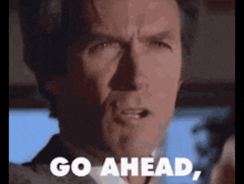 a man in a suit and tie says go ahead .