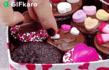 Decorating Chocolates Gifkaro GIF - Decorating Chocolates Gifkaro Sweets GIFs
