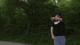a blurry picture of a man wearing a hat and a black shirt