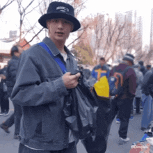 a man wearing a black hat that says brooklyn