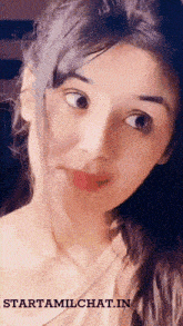 a close up of a woman 's face with the website starttamilchat.in written on the bottom