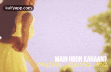 a close up of a woman 's face with the words main hoon kahaan