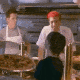a man with red hair is talking to a woman