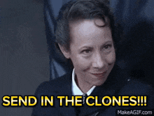 a woman is smiling and says send in the clones !!!