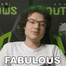 a man wearing glasses is sitting in a chair with the word fabulous on his shirt