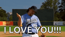 a man in a baseball uniform is standing on a baseball field .