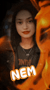 a woman in a black shirt that says nem