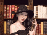 a woman in a cowboy hat is holding a gun in front of a bookshelf that has a book titled strict court on it