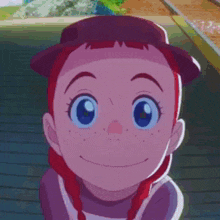 a cartoon girl with red hair and blue eyes is smiling and wearing a hat