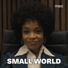 a woman in a suit says small world