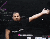 a man stands in front of a blackboard with a purple arrow pointing to the right