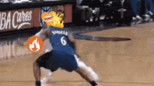 a basketball player wearing a number 6 jersey dribbles the ball