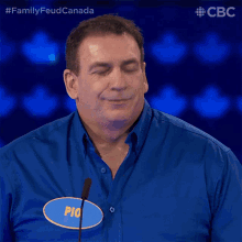 a man in a blue shirt has a name tag that says pio
