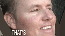 a close up of a man 's face with the words " that 's " above him