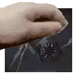 a person 's hand is reaching out towards a clock