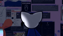 a cat is looking at a computer screen with the word kikiyama on the top