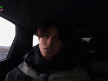 a man in a car with the words music is my life behind him