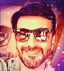 a man with a beard is wearing sunglasses and smiling for the camera