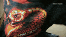 a blurry picture of a snake with the word rock on it