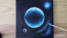 a painting of a blue planet with the words made in animatica on the bottom