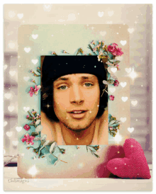 a picture of a man surrounded by flowers and hearts