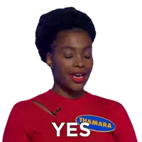 a woman wearing a red sweater that says thama yes