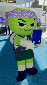 a green cartoon character with a purple headband holding a cell phone