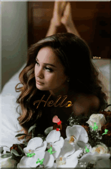 a picture of a woman laying on a bed with the word hello written on the bottom