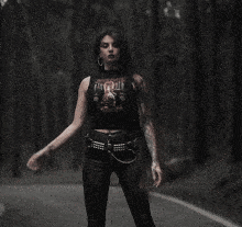 a woman with long hair is wearing a t-shirt that says ' slayer ' on it