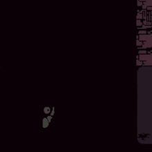 a cartoon character is standing in the dark in front of a brick wall in a video game .