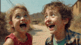 a boy and a girl with their mouths open