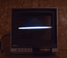 a sasha television is turned off and sitting on a shelf