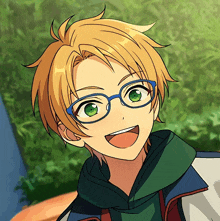 a close up of a person wearing glasses and a green scarf