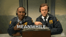 two men in fbi uniforms are sitting at a table and one of them says meanwhile