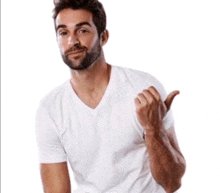 a man with a beard is wearing a white shirt and pointing to the left