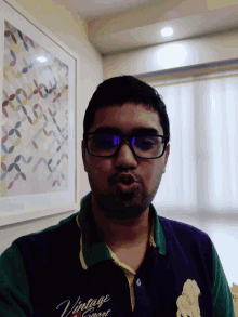 a man wearing glasses and a shirt that says ' vintage ' on it