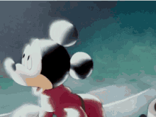 a close up of mickey mouse 's face with a blue background