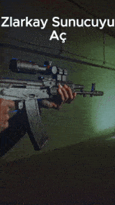 a person holding a rifle with a scope and the words zlarakay sunucuyy ac on the bottom