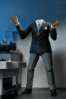 a statue of a man without a head is wearing gloves
