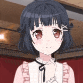 a girl with short hair and red eyes is wearing a pink and white dress and ruffled sleeves .