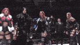 a group of women in a wrestling ring with a sign that says lawson on it