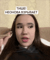 a woman is holding a cigarette in her hand and has a sticker that says ' tishe ' on her face