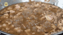 a close up of a pan of food with the words made in animatica on the bottom right