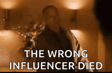 a man standing in a room with the words " the wrong influencer died " behind him
