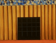 a wooden wall with a black square in the middle of it