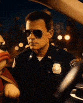 a police officer is talking to a stuffed animal