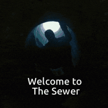 a dark tunnel with the words welcome to the sewer written on it