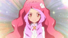 a girl with long pink hair and a flower in her hair is smiling and looking at the camera .