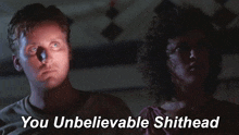 a man and a woman are standing next to each other with the words " you unbelievable shithead " above them
