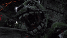 a green monster is standing in a dark room with christmas lights in the background